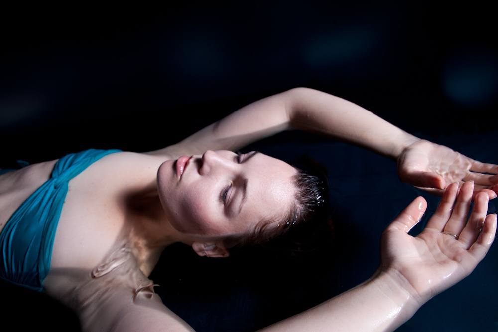 Woman Floating Inside of a Float Tank