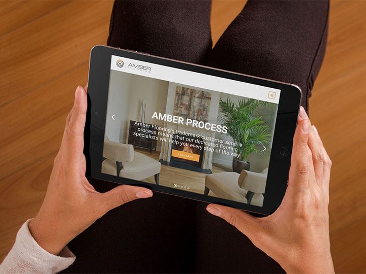 Amber Flooring website viewed on a black iPad.