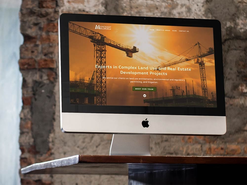Monchamp Meldrum LLP website viewed on an iMac.